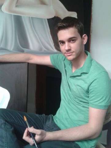 El joven pintando uno de sus cuadros (Foto TA)