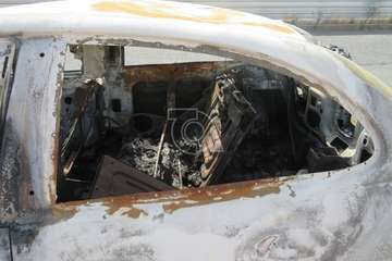 Desvalijado y quemado en una calle de la urbanización Picachos/TA.