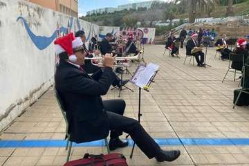 Concierto navideño de la Banda Municipal de Música en el CEIP Montiano Placeres/TA.