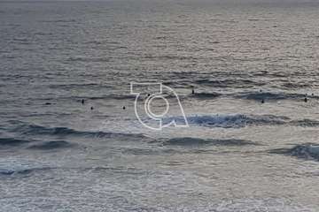 Surfistas en Playa del Hombre (Foto TA)