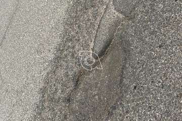 Baches y socavones en la calle de Torriani (Foto TA)